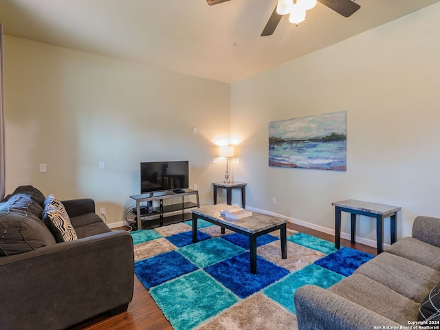 living room with ceiling fan and hardwood / wood-style flooring