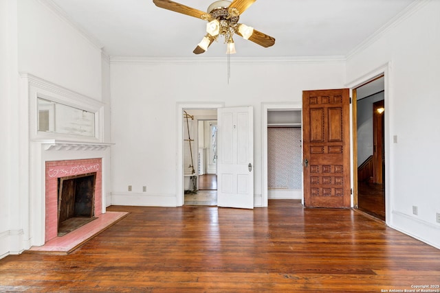 unfurnished living room with baseboards, a fireplace, ornamental molding, and wood finished floors