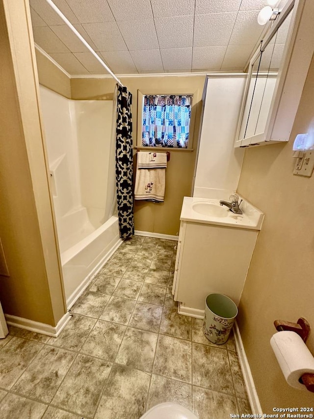 bathroom with shower / tub combo with curtain and vanity