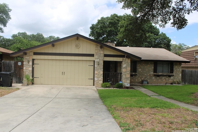 ranch-style home with a garage and a front lawn