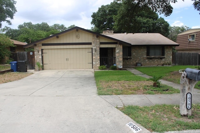 ranch-style house featuring a garage and a front yard