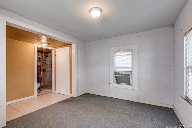 carpeted spare room featuring cooling unit
