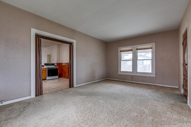 unfurnished bedroom with light colored carpet