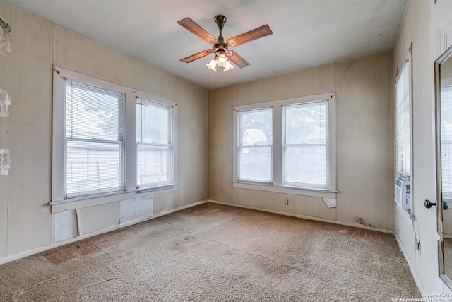 unfurnished room featuring light carpet and ceiling fan
