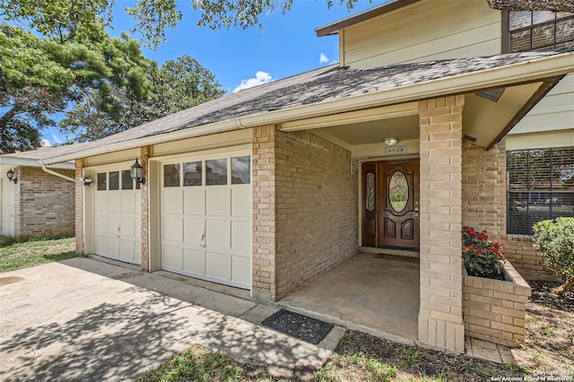 entrance to property featuring a garage