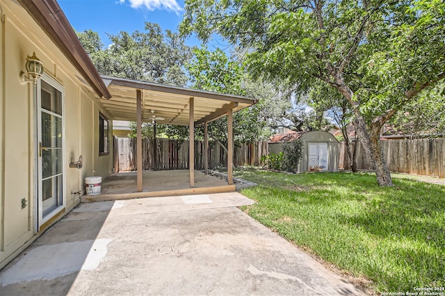 view of patio with a storage unit