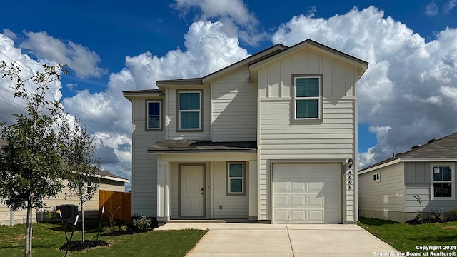 view of front of house featuring a garage and a front yard