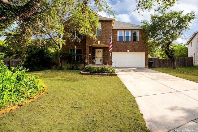 view of front facade featuring a garage and a front lawn