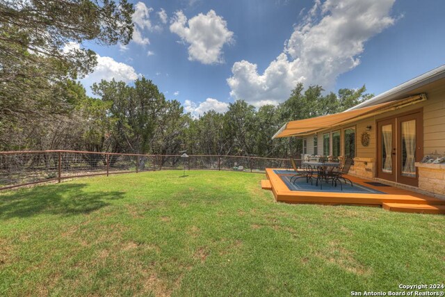 120 Sierra Way, Canyon Lake, TX 78133 - view of yard featuring a deck and french doors