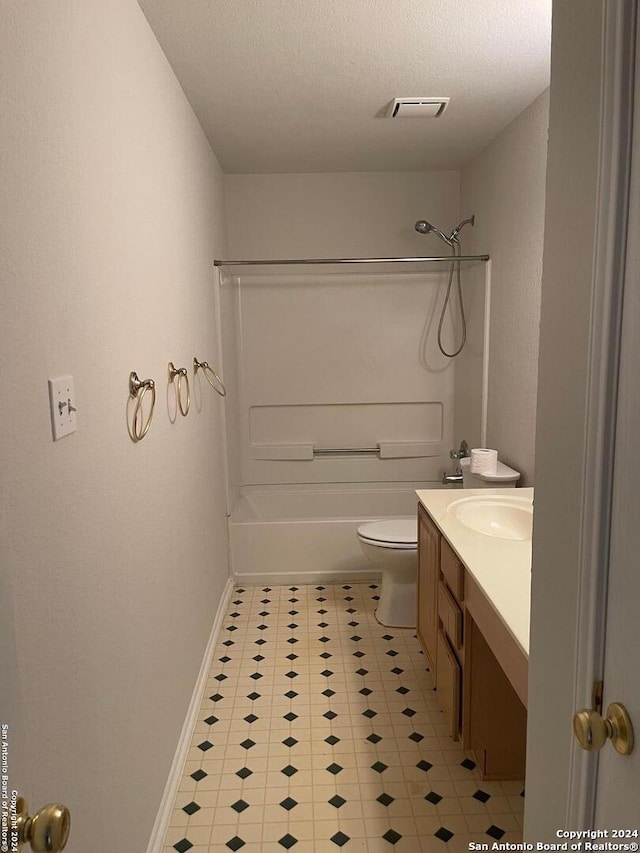 full bathroom featuring shower / bathing tub combination, vanity, a textured ceiling, and toilet