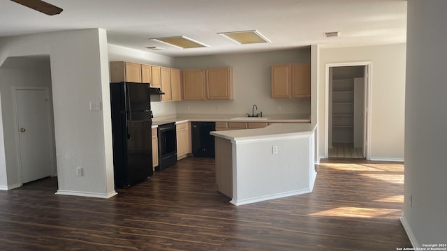 kitchen with a center island, light brown cabinets, dark wood-type flooring, black appliances, and sink