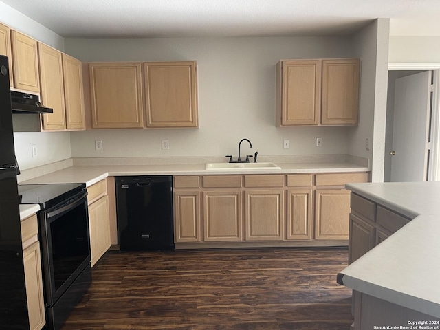 kitchen featuring light brown cabinets, sink, dark hardwood / wood-style floors, and black appliances