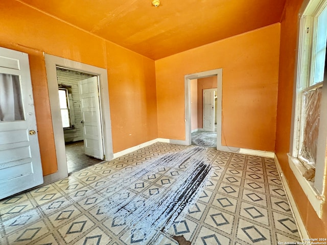 unfurnished bedroom with tile floors