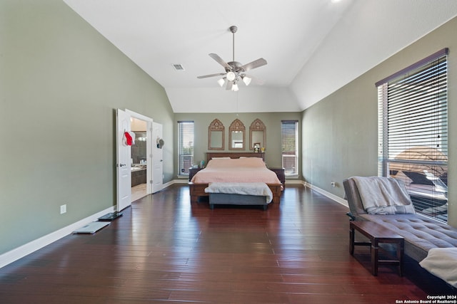 bedroom with connected bathroom, lofted ceiling, dark hardwood / wood-style floors, and ceiling fan