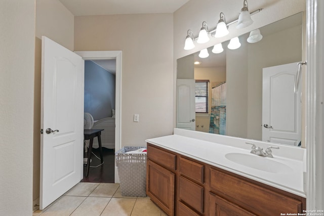 bathroom featuring vanity, tile patterned floors, and curtained shower