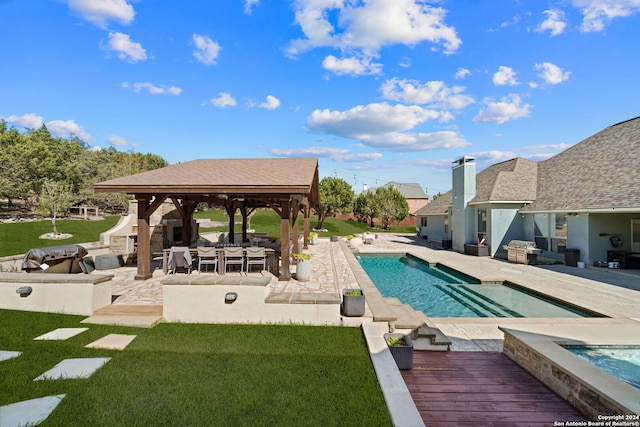 view of pool featuring a hot tub, a gazebo, a yard, and a patio area