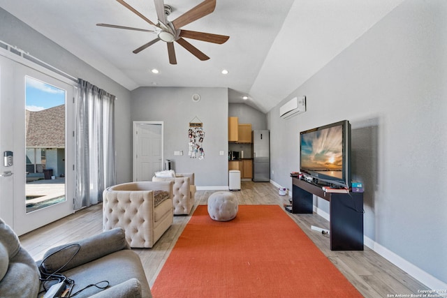 living room featuring light hardwood / wood-style floors, an AC wall unit, lofted ceiling, and ceiling fan