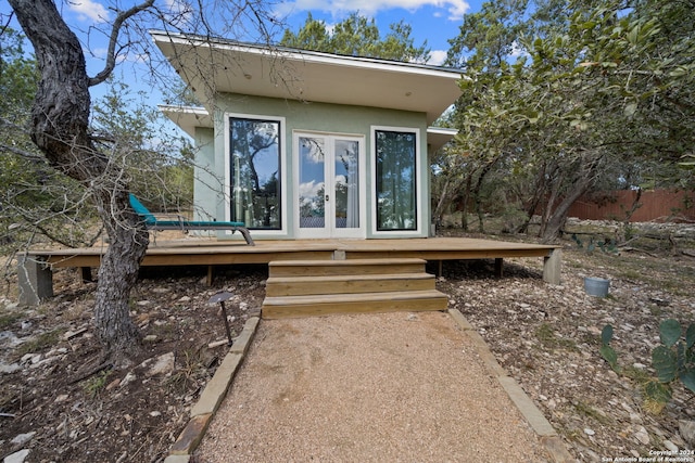 exterior space with french doors and a deck