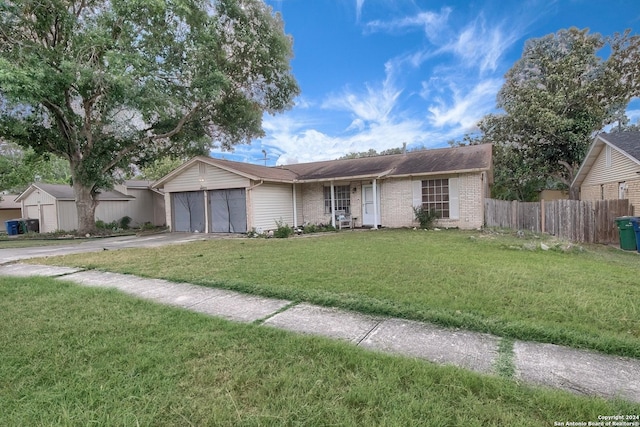 ranch-style house with a front yard and a garage