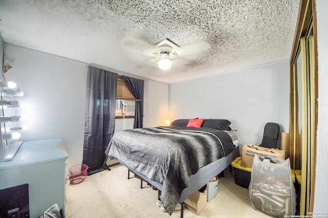 bedroom featuring a textured ceiling and ceiling fan