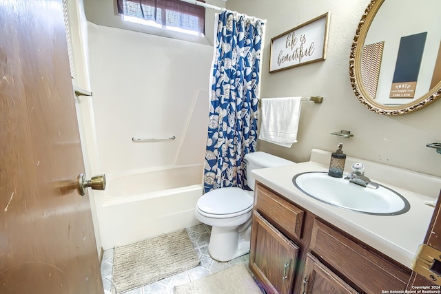 full bathroom with tile patterned floors, shower / bath combo, toilet, and vanity