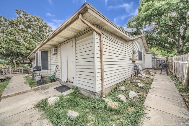 view of home's exterior featuring a wooden deck