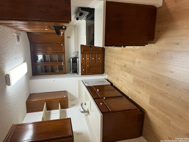 kitchen featuring wooden walls