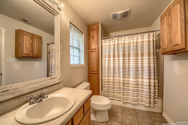 full bathroom with tile patterned flooring, vanity, toilet, and shower / tub combo with curtain