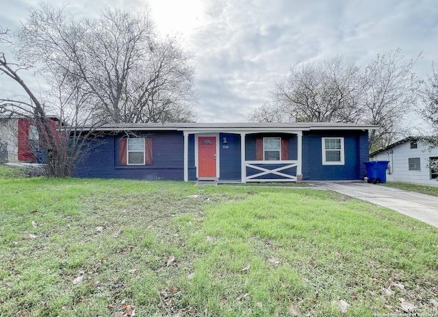 ranch-style house with a front lawn