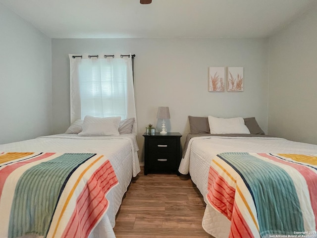 bedroom with hardwood / wood-style floors