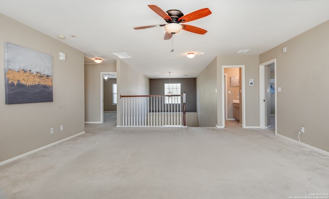 carpeted empty room featuring ceiling fan