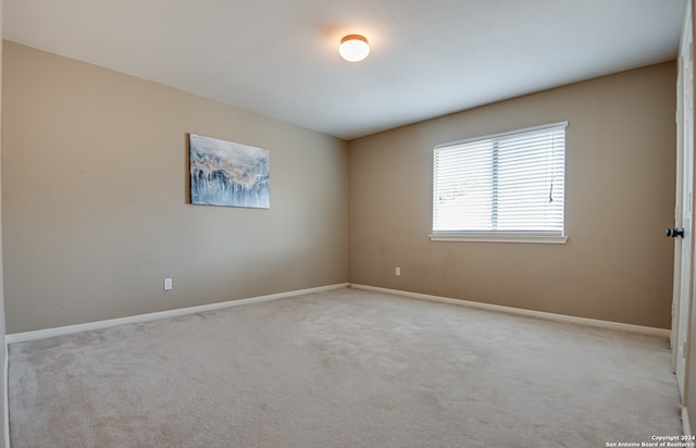 empty room with carpet flooring