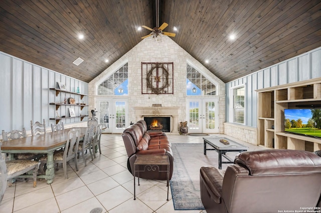 living room with ceiling fan, wooden ceiling, high vaulted ceiling, and french doors