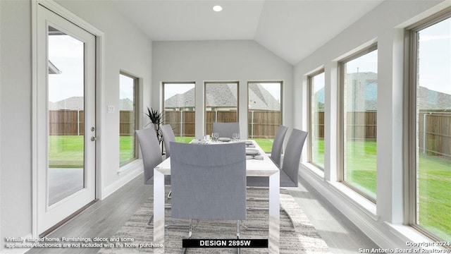 unfurnished sunroom with vaulted ceiling and plenty of natural light