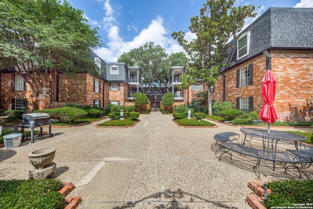 view of property's community with a patio area