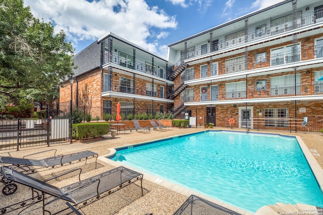 view of swimming pool with a patio area