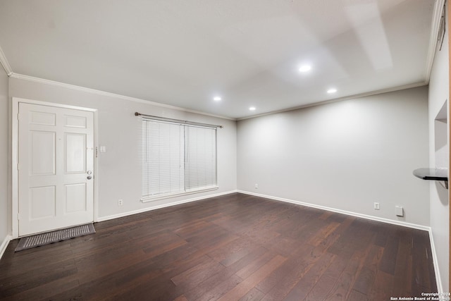 interior space featuring ornamental molding and dark hardwood / wood-style floors