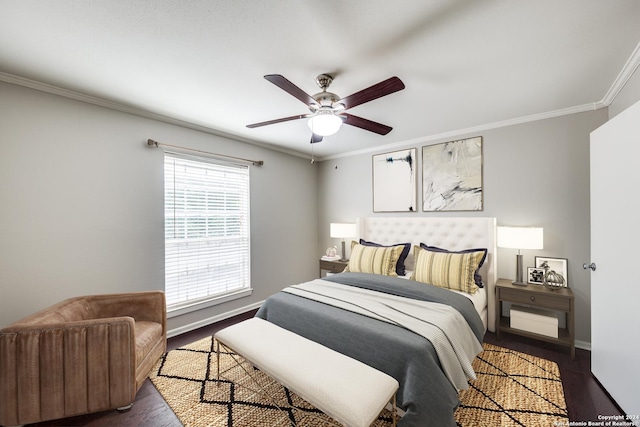 bedroom featuring ceiling fan, crown molding, and dark wood-type flooring