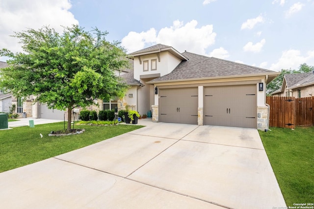 prairie-style home featuring a garage and a front yard