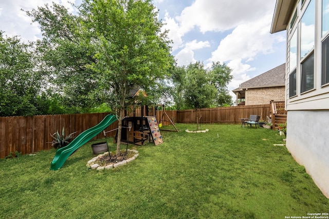 view of yard with a playground