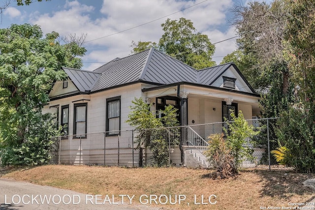 view of property exterior with covered porch