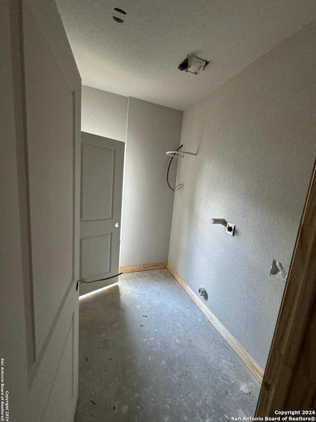 spare room with concrete floors