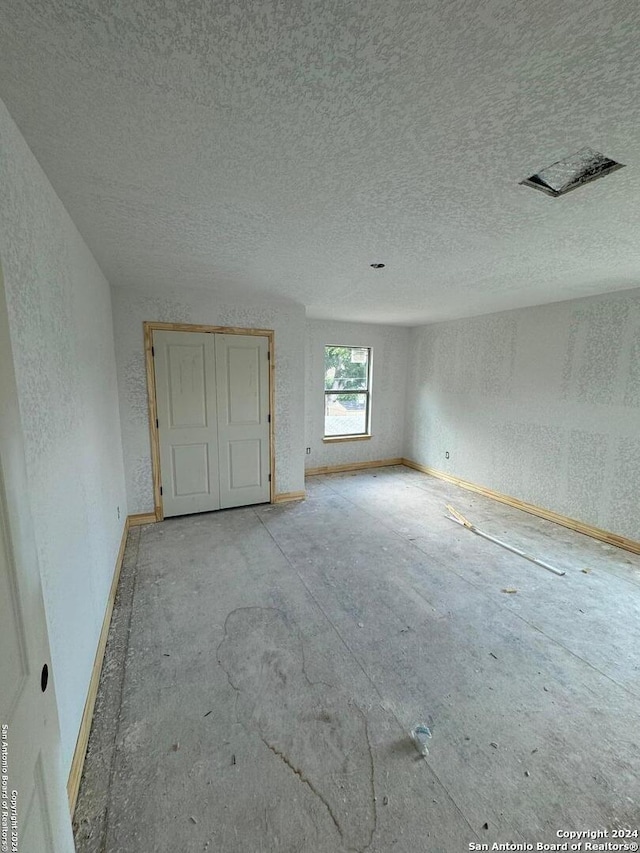 interior space with a textured ceiling