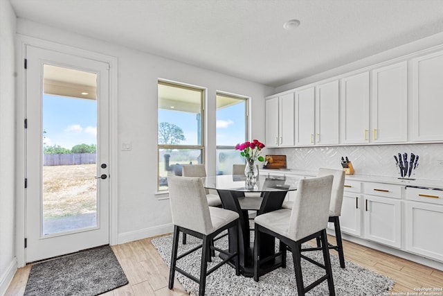 dining room featuring light hardwood / wood-style floors and plenty of natural light