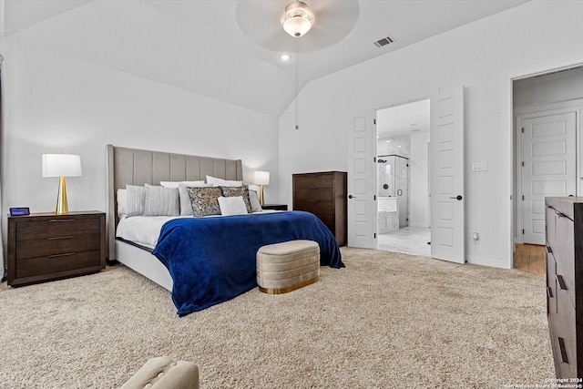 carpeted bedroom with vaulted ceiling, ensuite bathroom, and ceiling fan