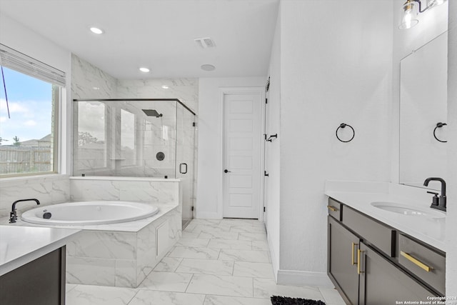 bathroom with tile floors, separate shower and tub, and vanity