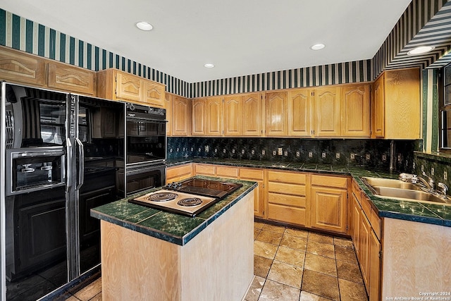 kitchen with sink, backsplash, a kitchen island, and black appliances