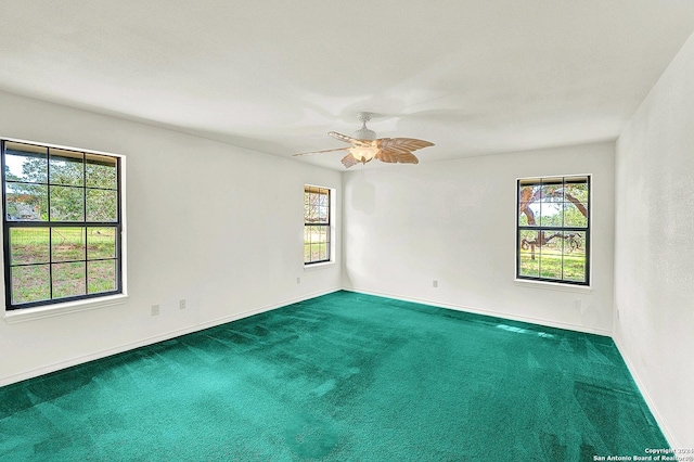 spare room with carpet flooring and ceiling fan