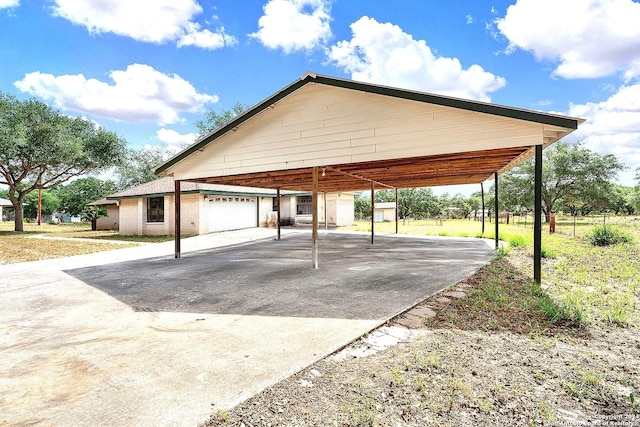 view of parking with a garage and a carport