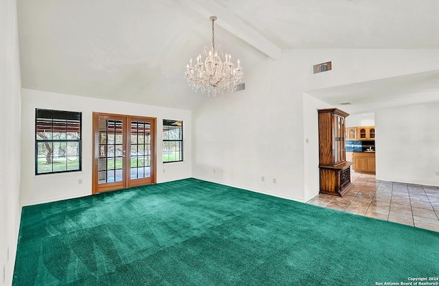 carpeted spare room with beam ceiling, french doors, high vaulted ceiling, and an inviting chandelier